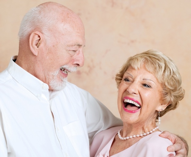 Senior man and woman laughing together