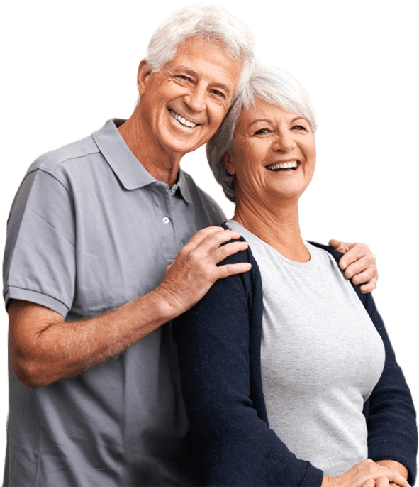 Smiling senior man hugging a smiling senior woman from behind