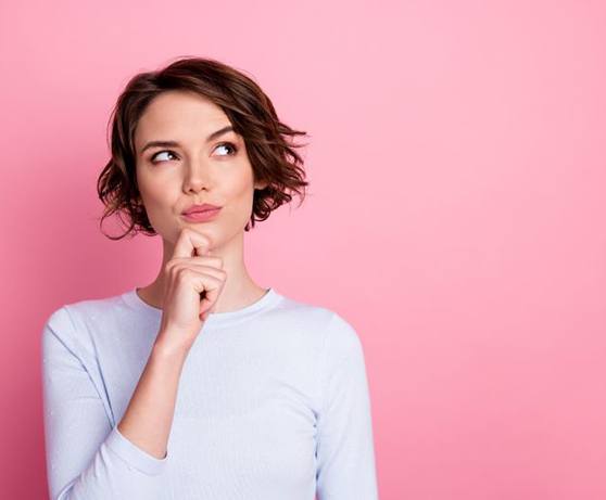 Woman with thoughtful, curious expression on her face