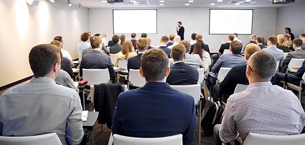 Group of people watching a presentation