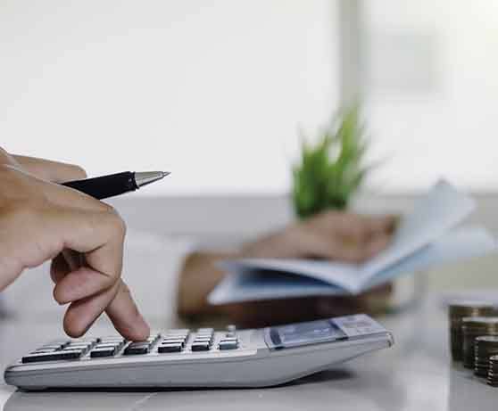 Man using a calculator