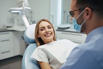 Happy patient in dental treatment chair