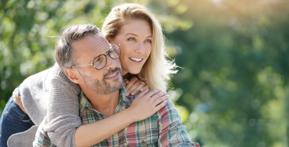 Man and woman smiling after oral surgery services in Reston