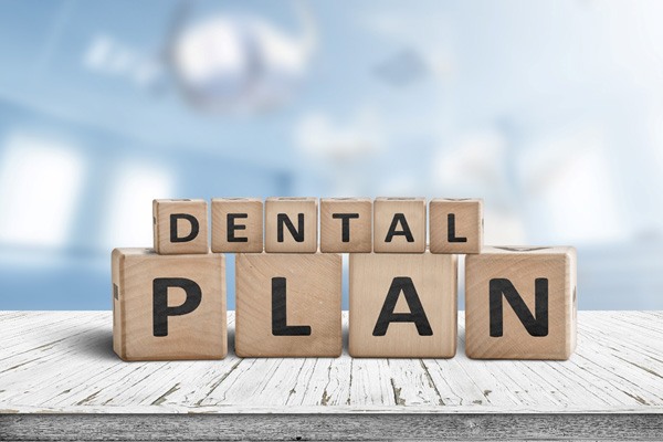 Blocks that spell out “dental plan”